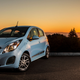 A photo of a pale blue Chevrolet Spark EV.